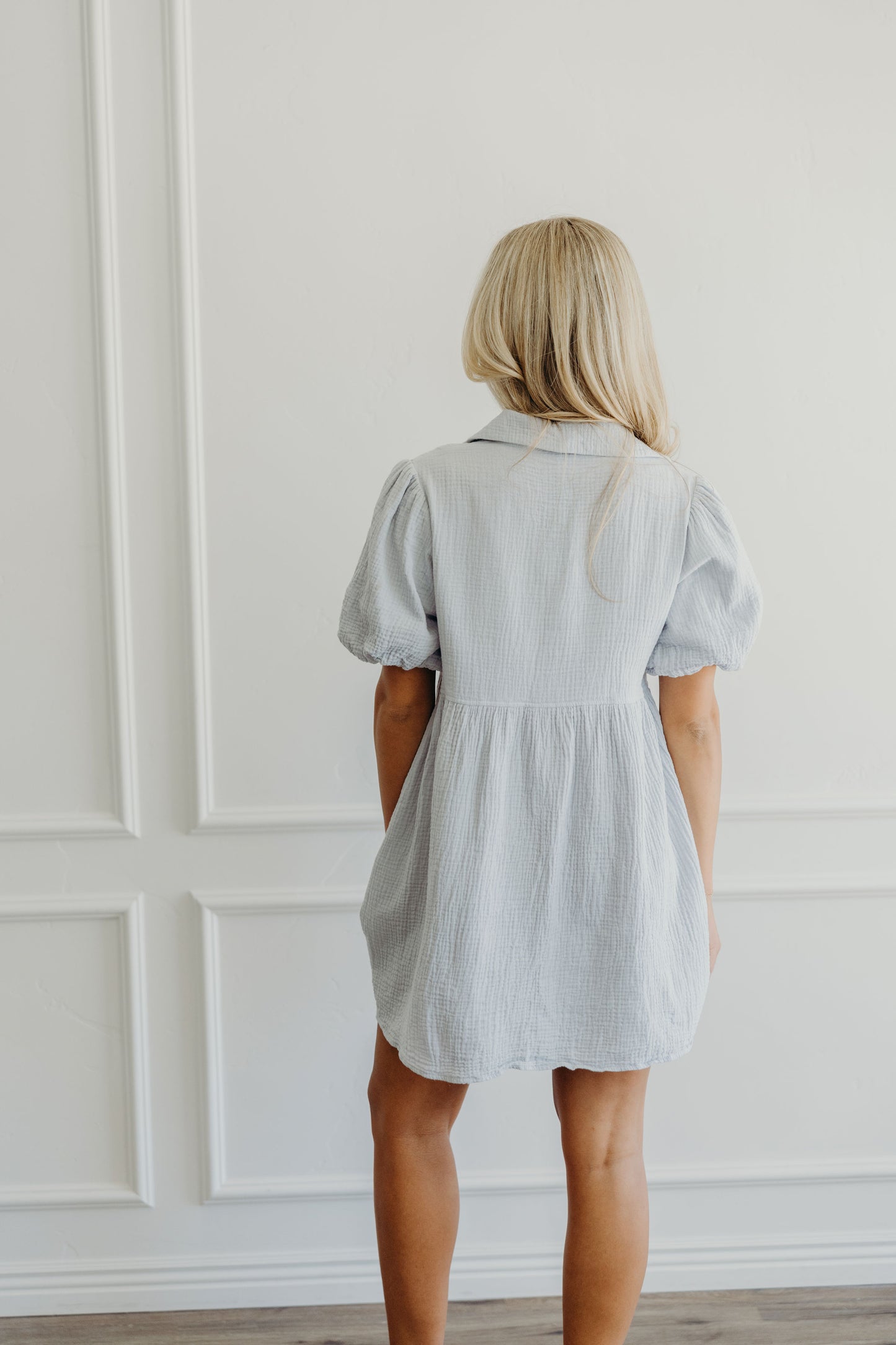 Back of short textured dress with collar detail.