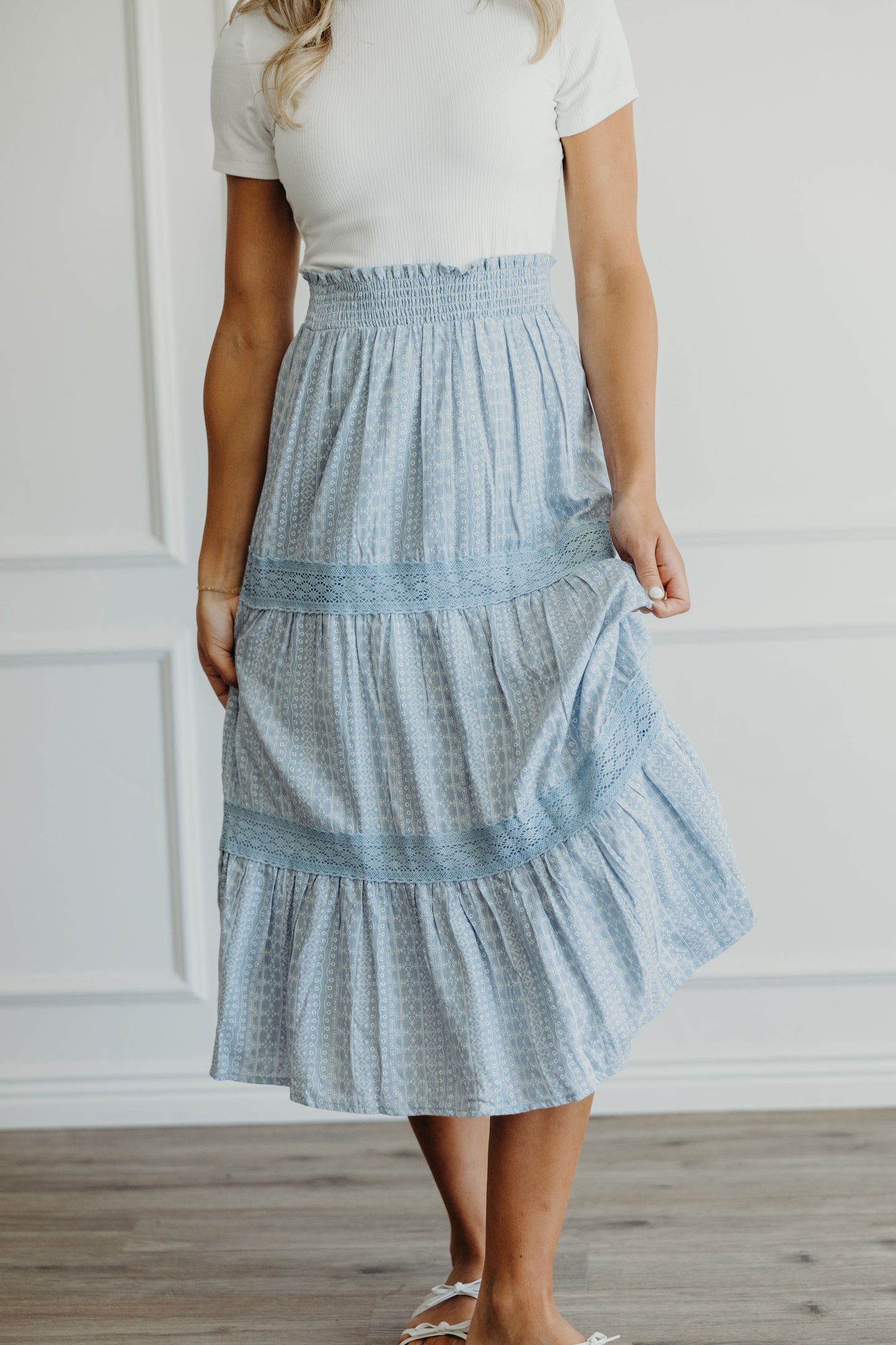 Midi length skirt with lace detail on tiers and smocked waist.