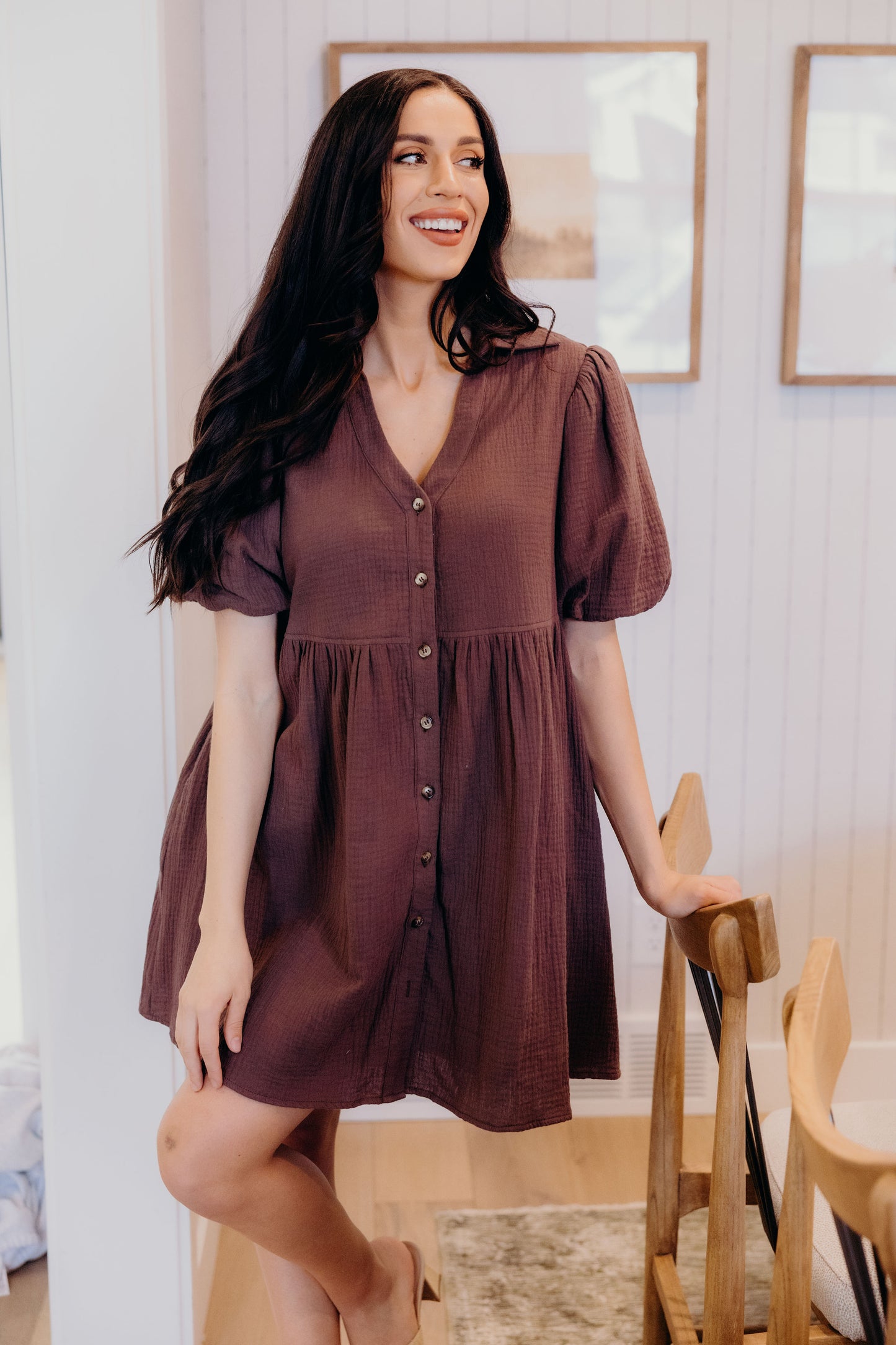 Short button down dress with v neckline and short sleeves.