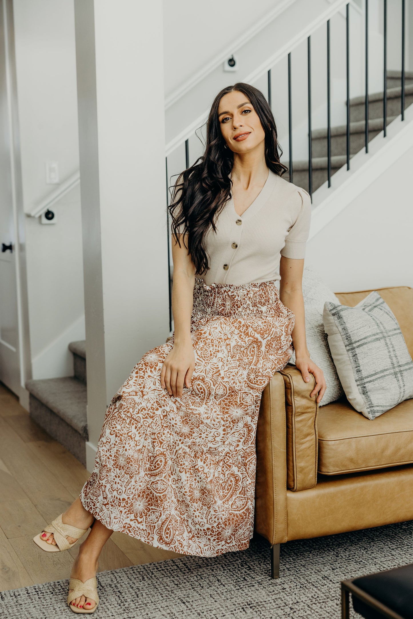 Maxi length skirt with copper paisley pattern and smocked waist.