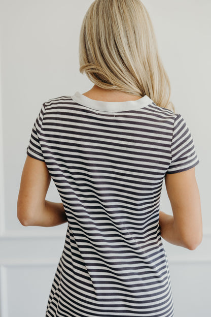 Back of dress with round neckline, short sleeve  and striped print.