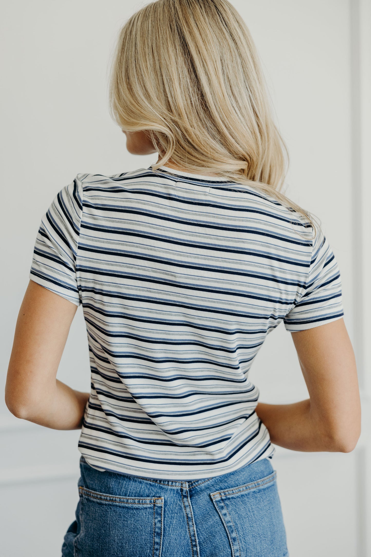 Ribbed navy and gray striped short sleeve tee.