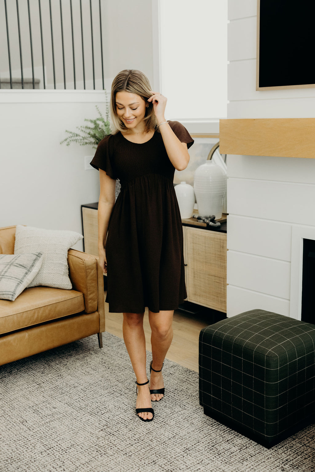 Knee length dress with natural waistline, smocked bodice, v neckline and short sleeves.