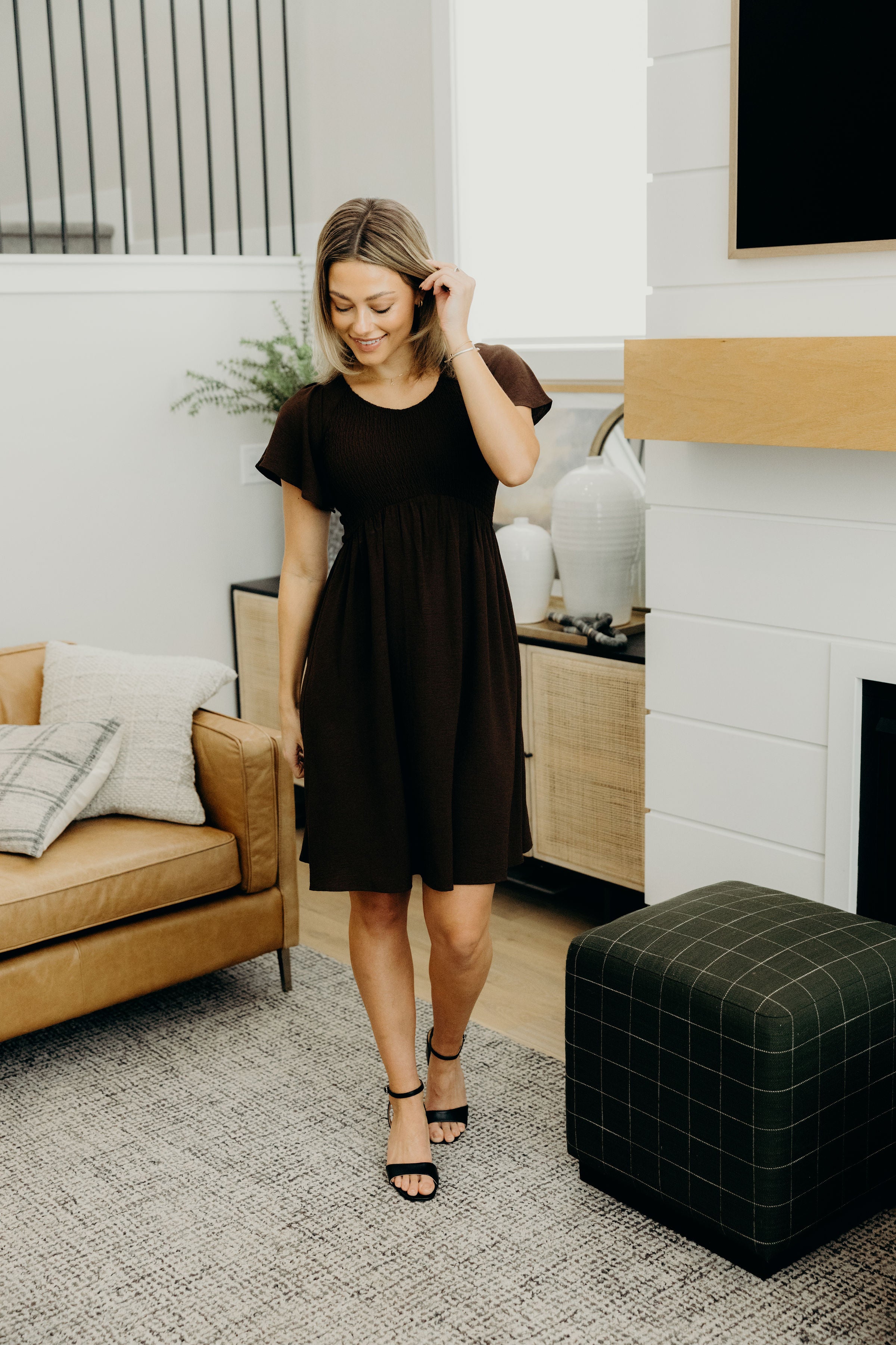 Knee length dress with natural waistline, smocked bodice, v neckline and short sleeves.