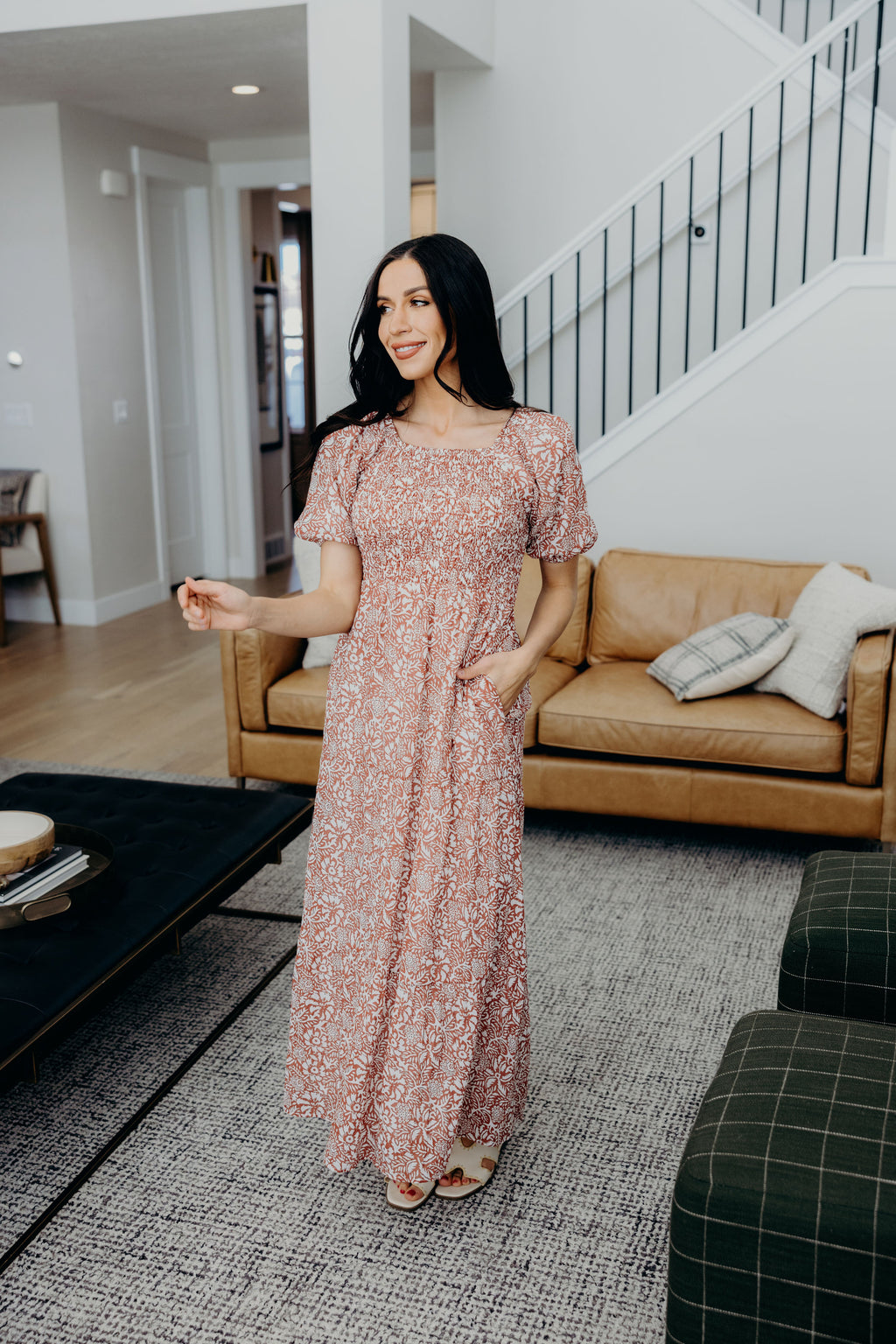 Maxi length dark pink print dress with smocked bodice, natural waistline, and pockets.