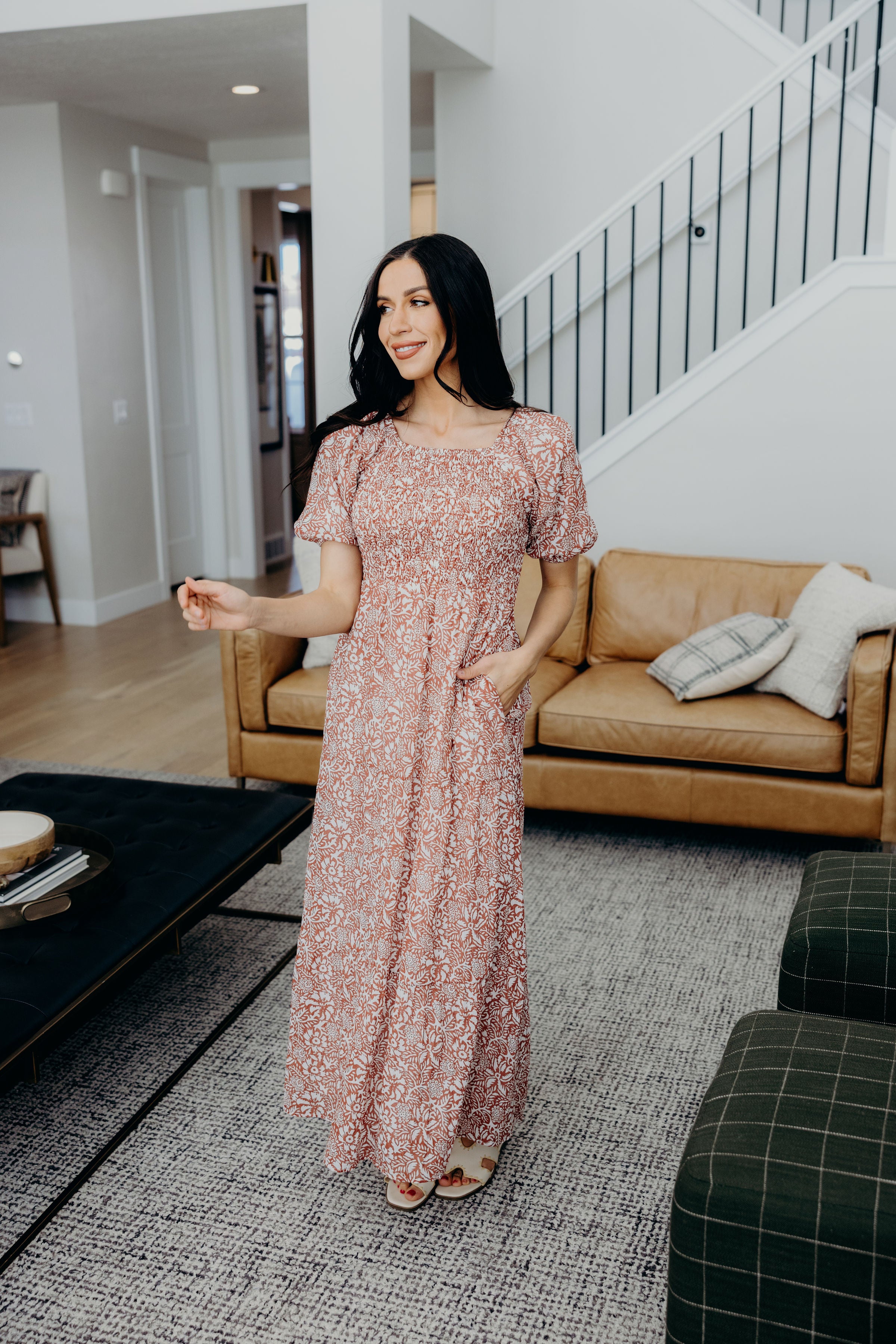 Maxi length dark pink print dress with smocked bodice, natural waistline, and pockets.