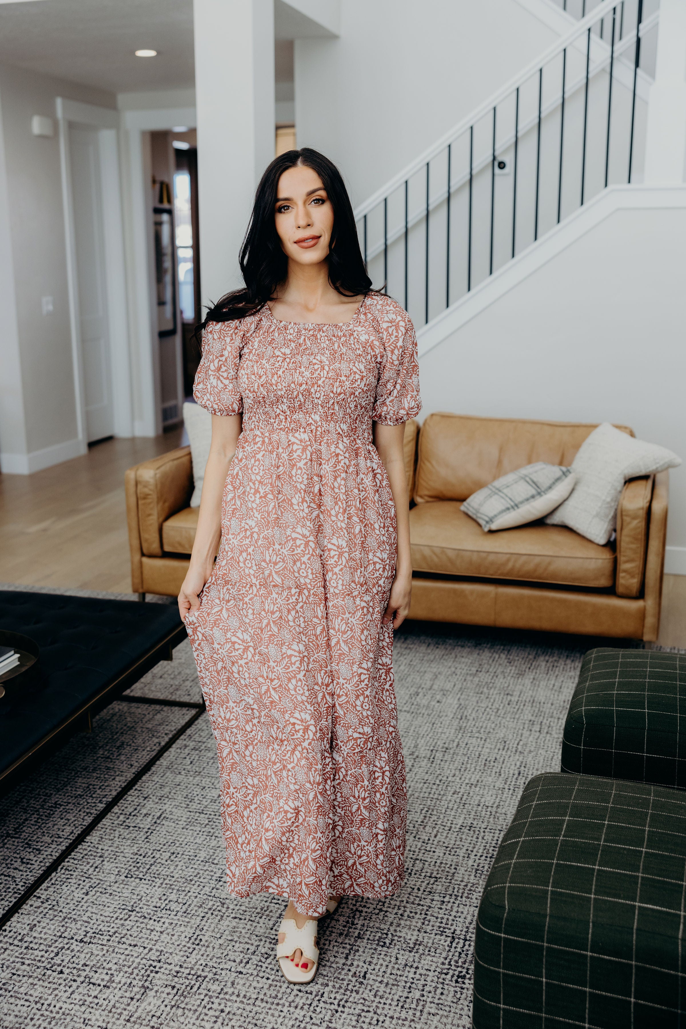 Maxi length dress with tiered skirt, square neckline, and short sleeves.