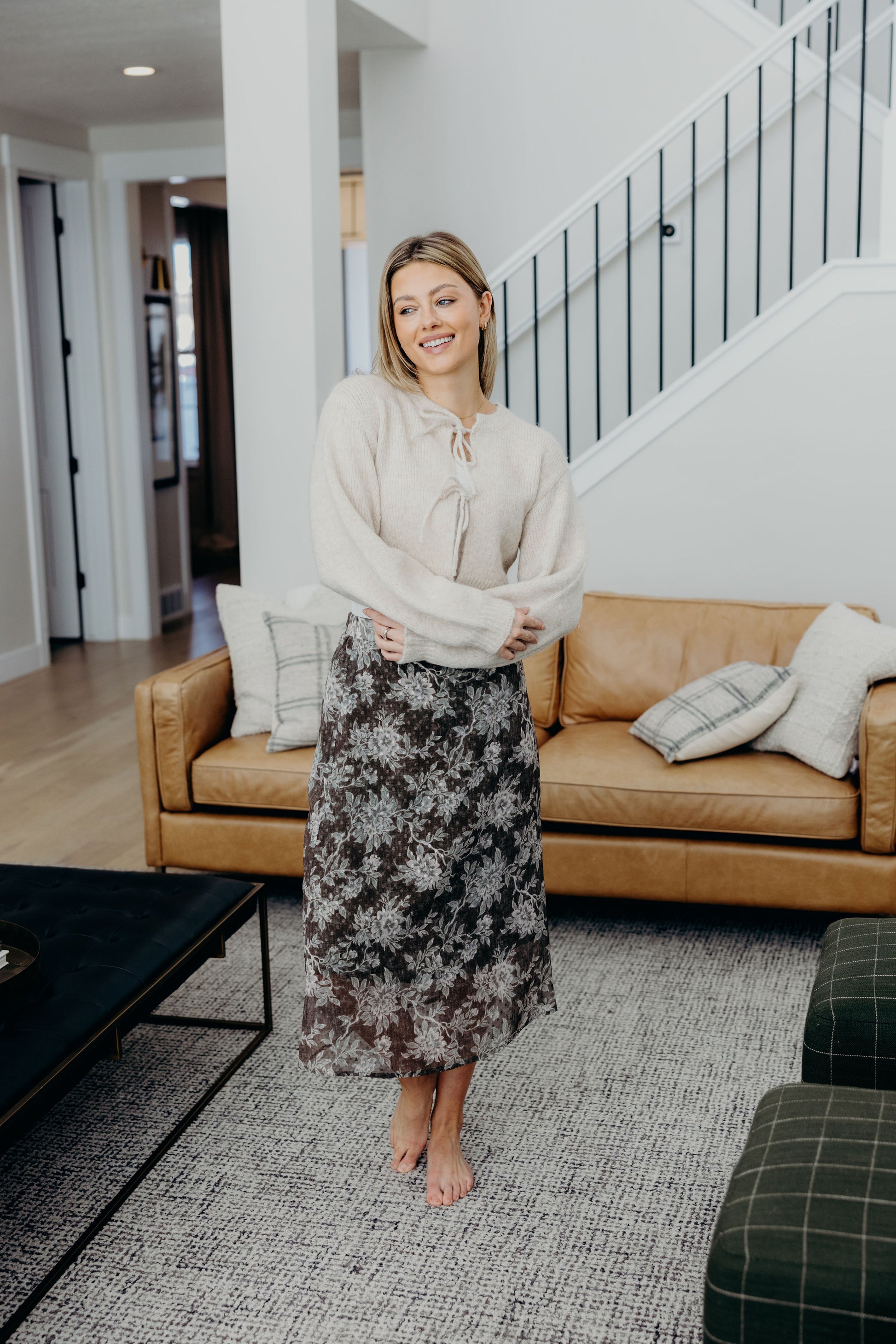 Midi length green skirt with floral print.