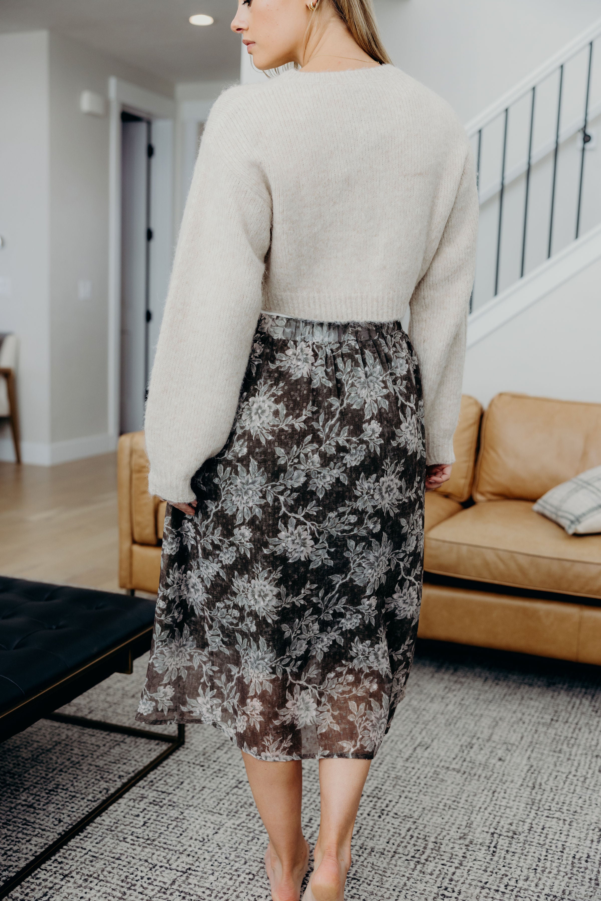 Back view of straight silhouette textured floral print skirt.