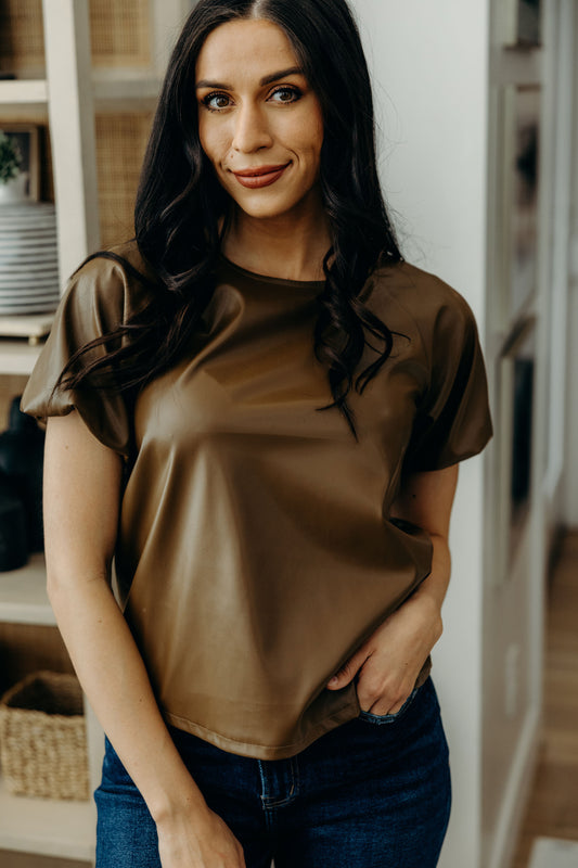 Short sleeve caramel faux leather top with puff sleeves.