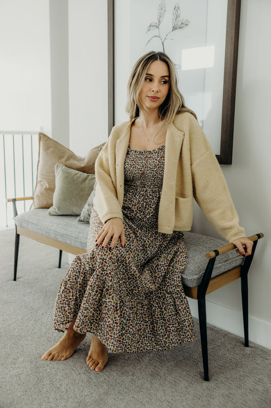 Textured button down cardigan with front pockets.
