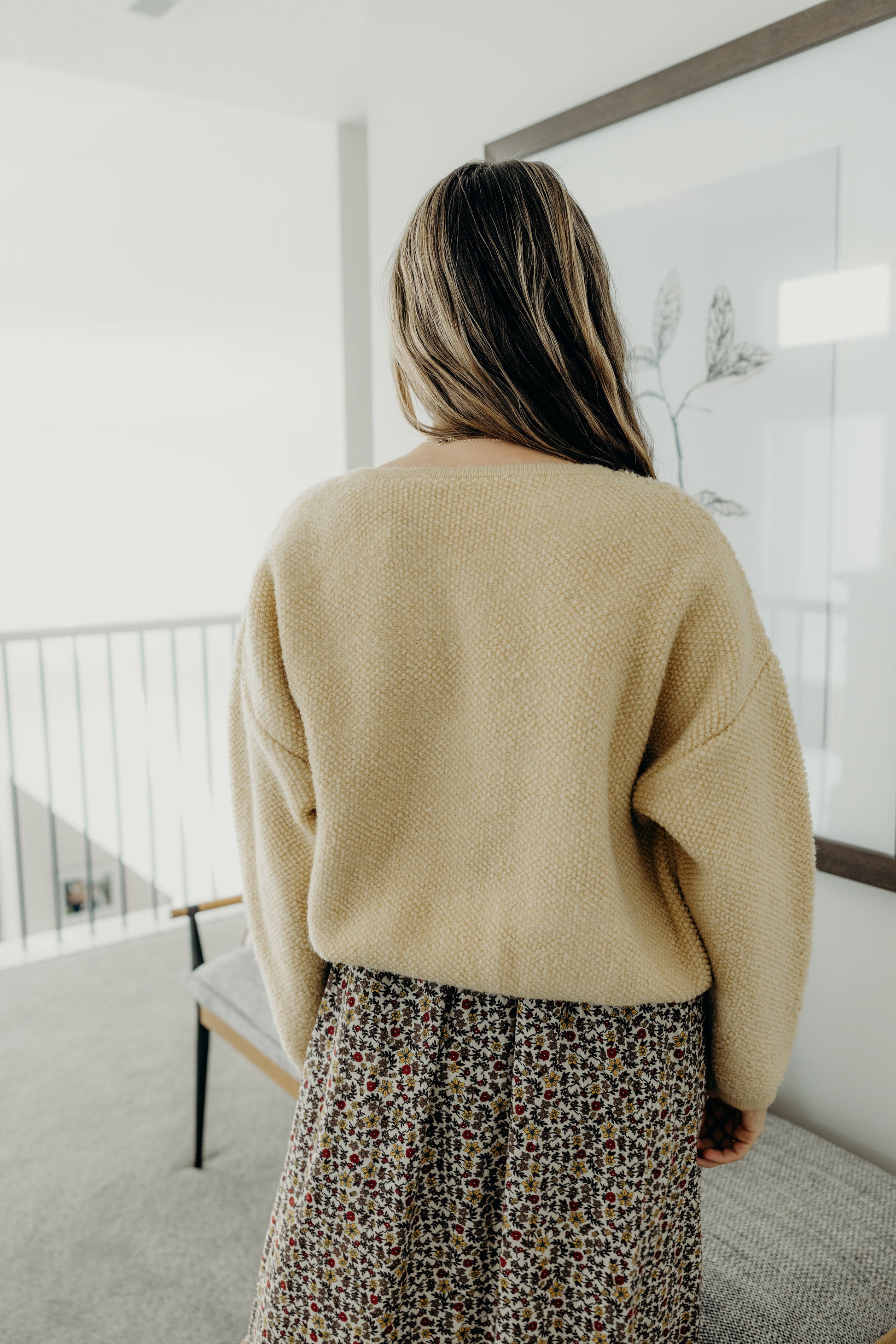 Back view of yellow textured knit cardigan.