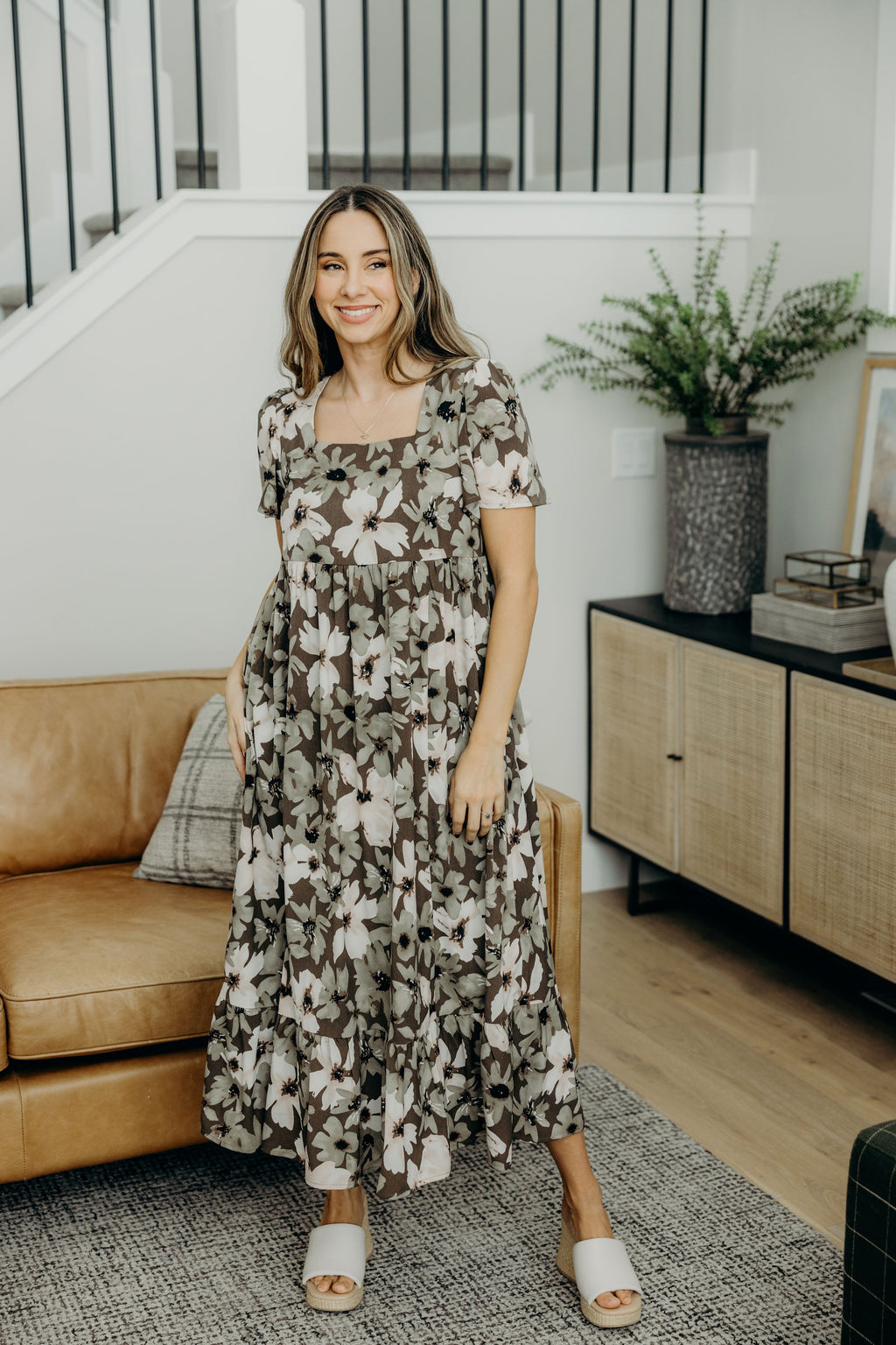 Green floral print dress with square neckline, short sleeves, empire waist, with ruffle hem.