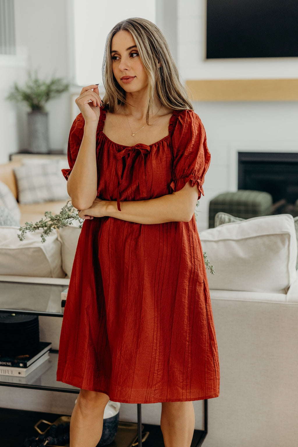 Textured shift dress with square neckline with half sleeve with ruffle detail.