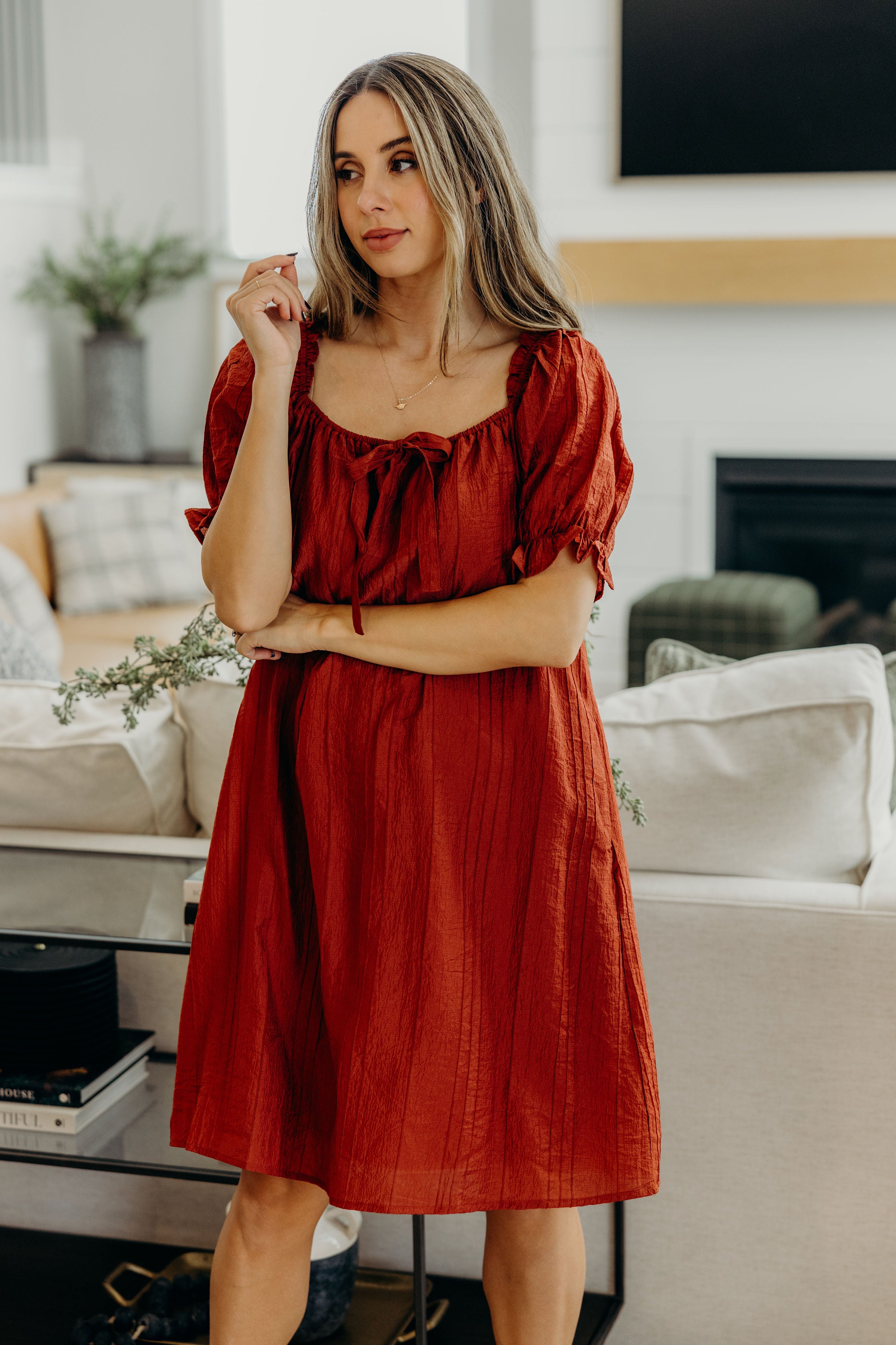 Textured shift dress with square neckline with half sleeve with ruffle detail.