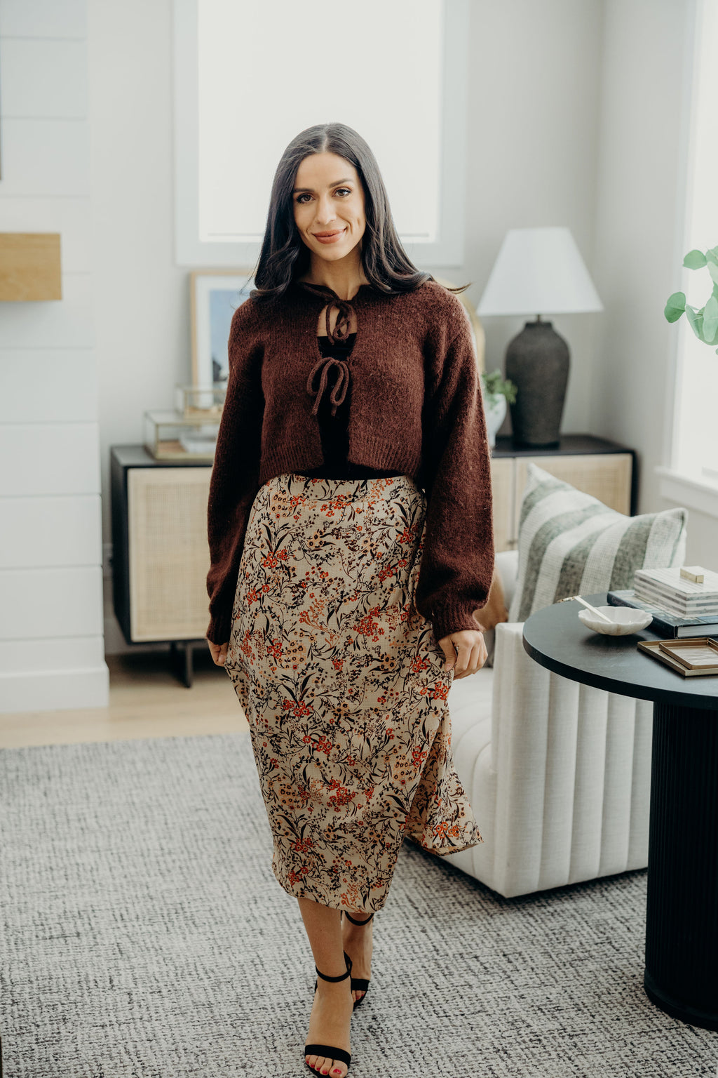 Midi length floral print skirt.