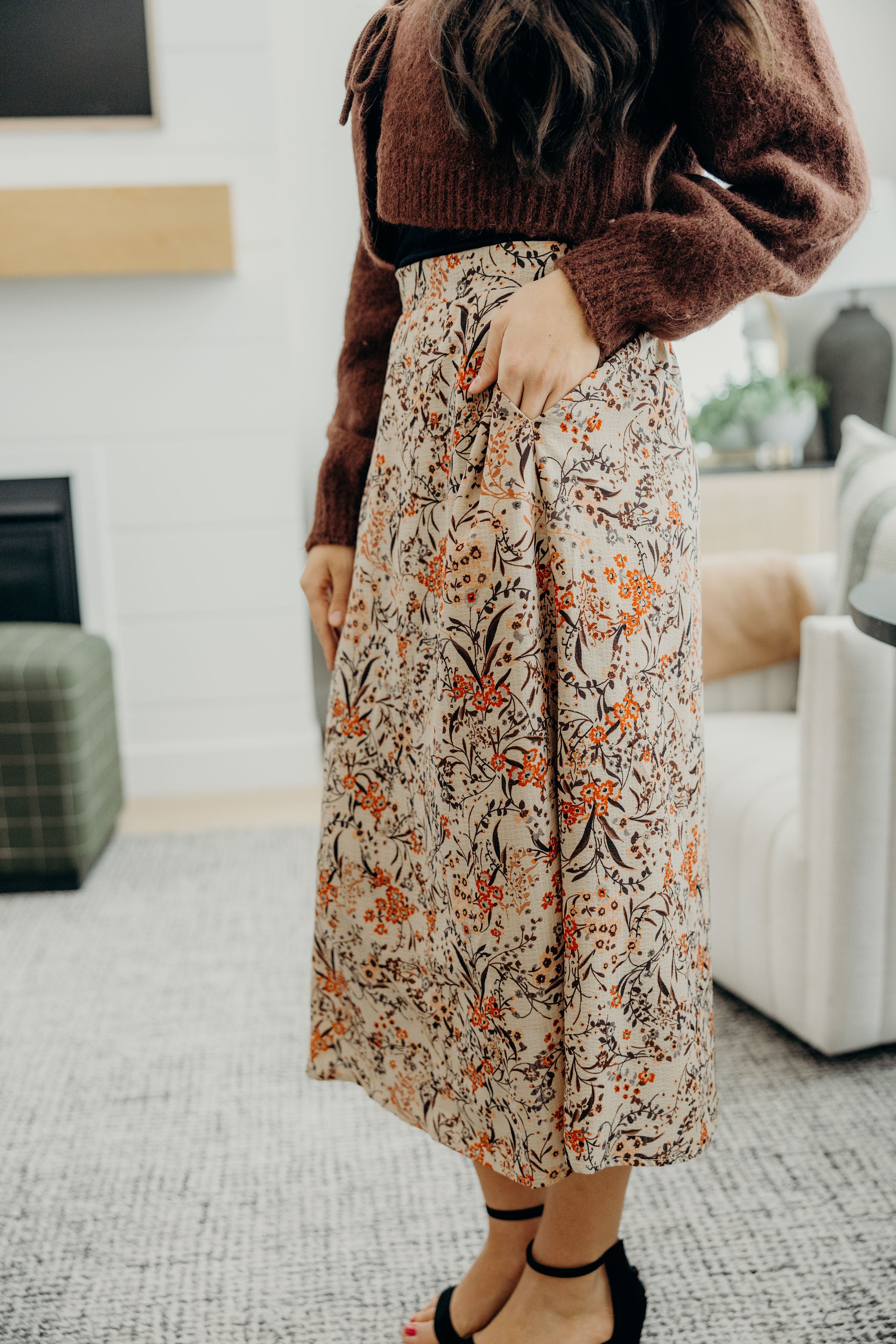 Sand colored skirt with fall floral print, midi length with pockets.